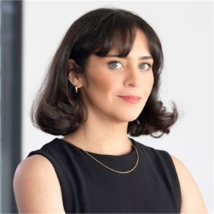 Ciara Moore in a black top, in front of a grey background